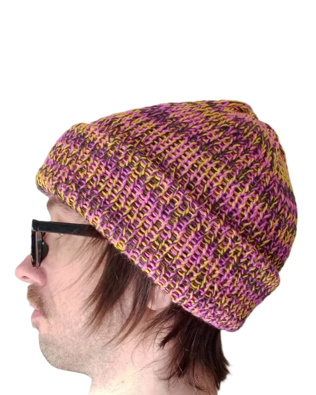 100% baby alpaca beanie in variegated yellow, pink, and charcoal on a model