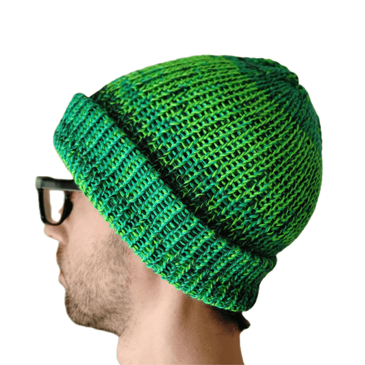 A variegated green baby alpaca beanie on a model