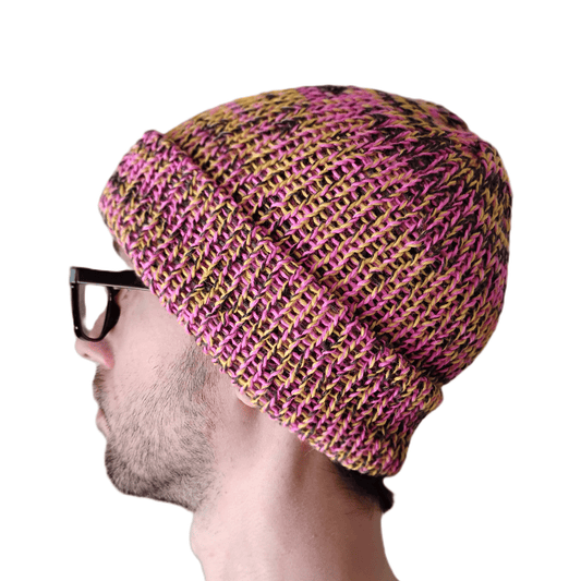 A variegated pink baby alpaca beanie on a model