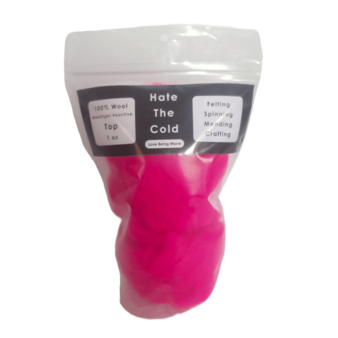 Wool top in fluorescent pink in a package with "Hate The Cold" on the label