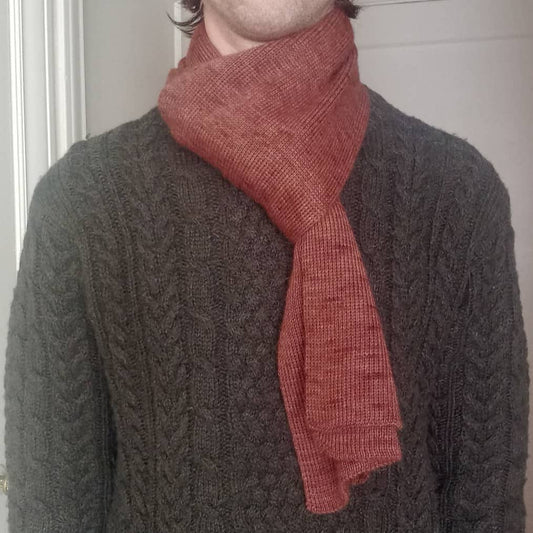 100% Peruvian Baby alpaca scarf in brown on a model.