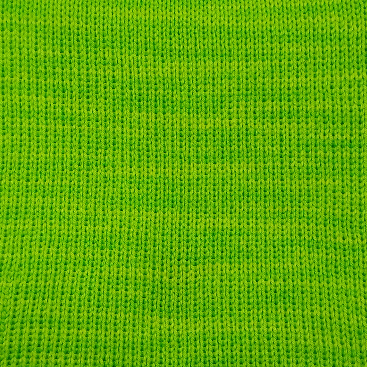 A close-up of fluorescent green knit merino wool in fingering weight.