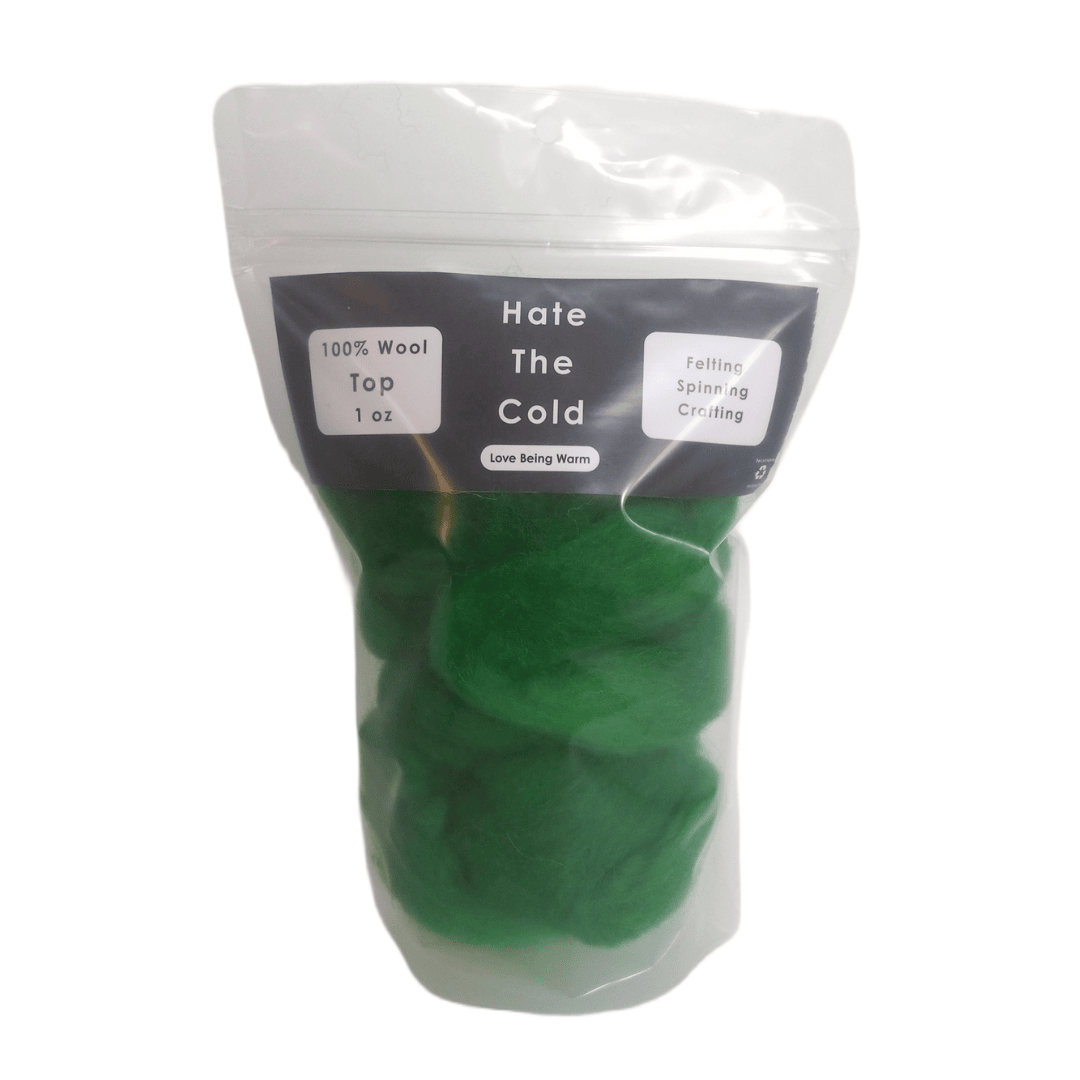 Green wool top in a package with "Hate The Cold" on the label