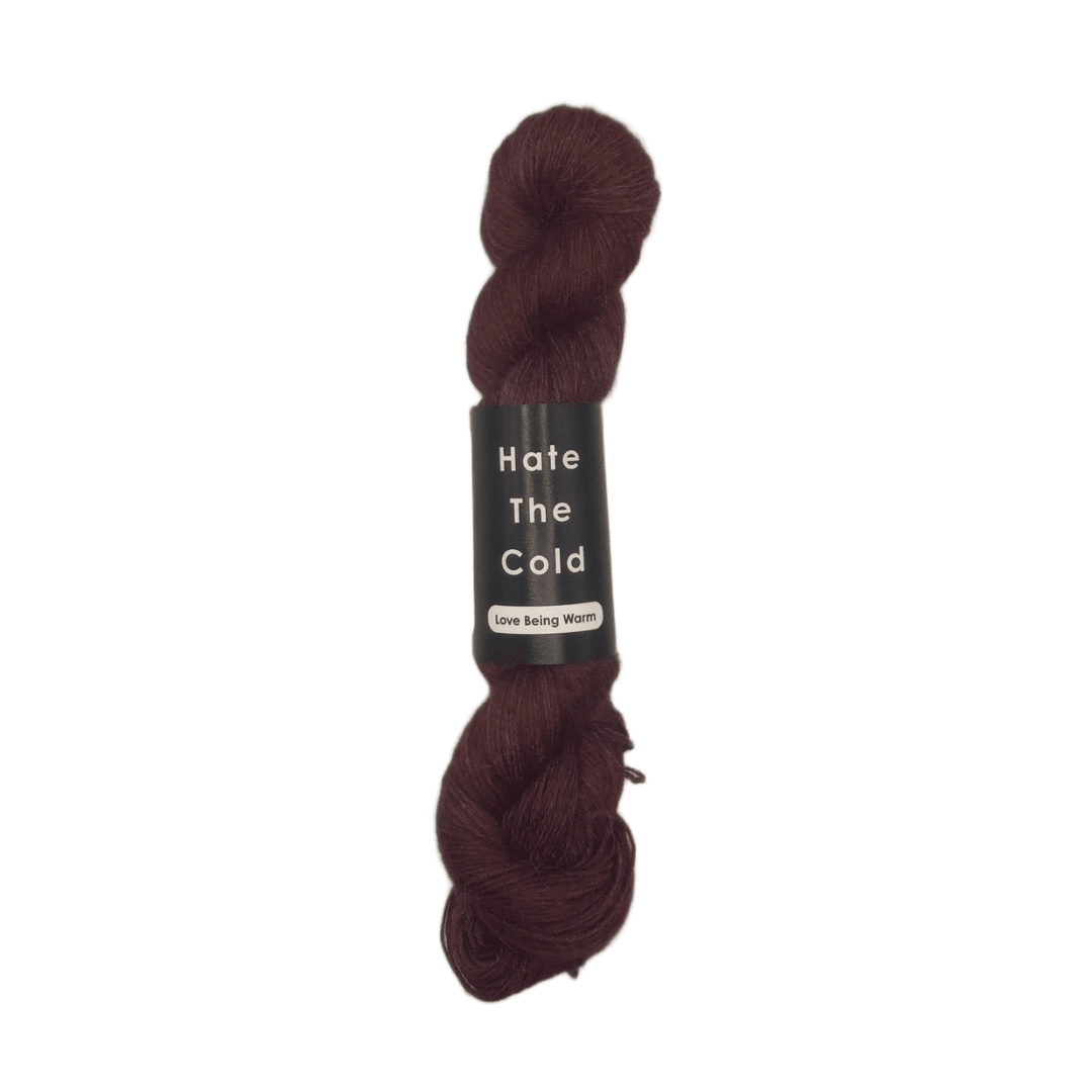 100% Peruvian baby alpaca yarn in plum, fingering weight.