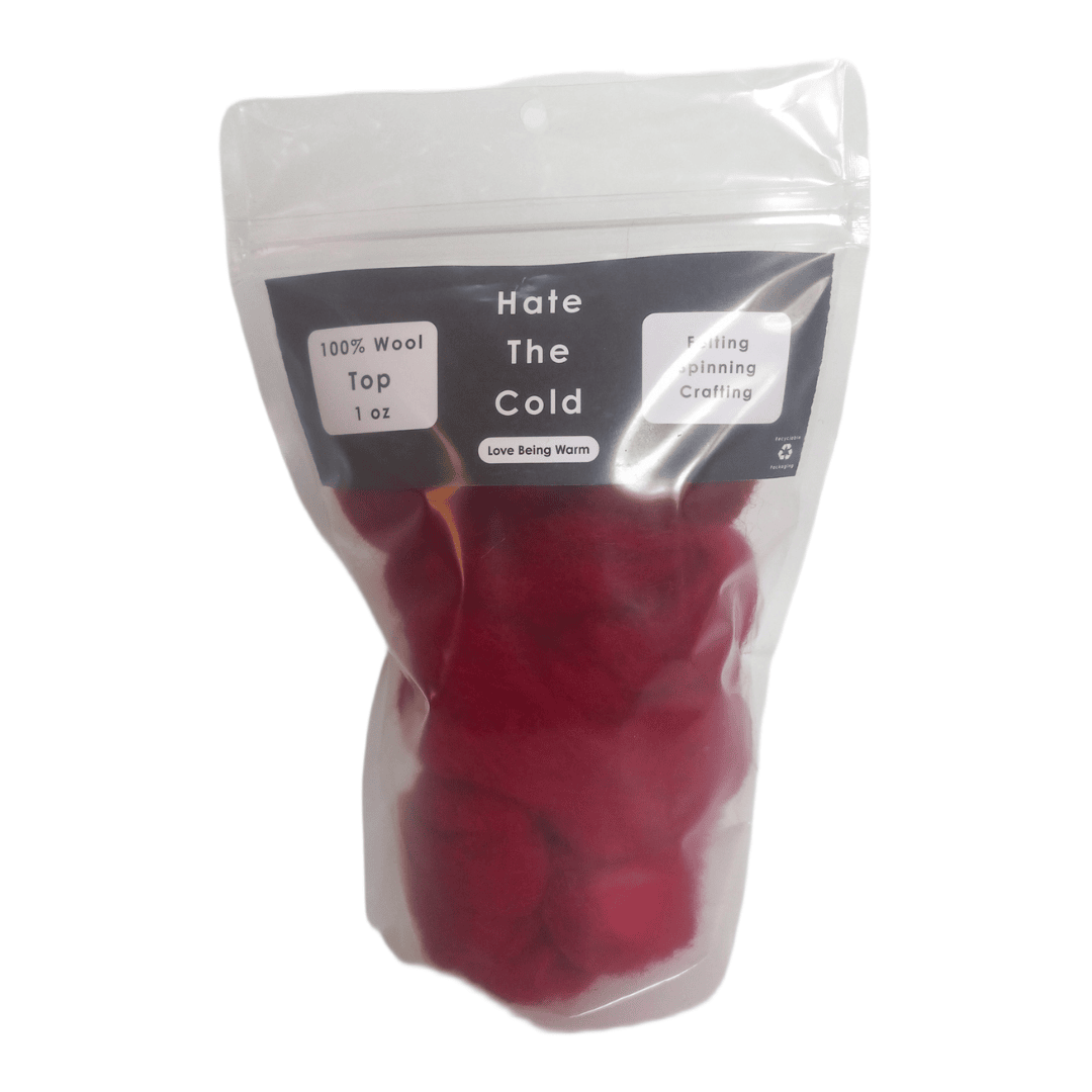 Red wool top in a clear bag with a label on a white background