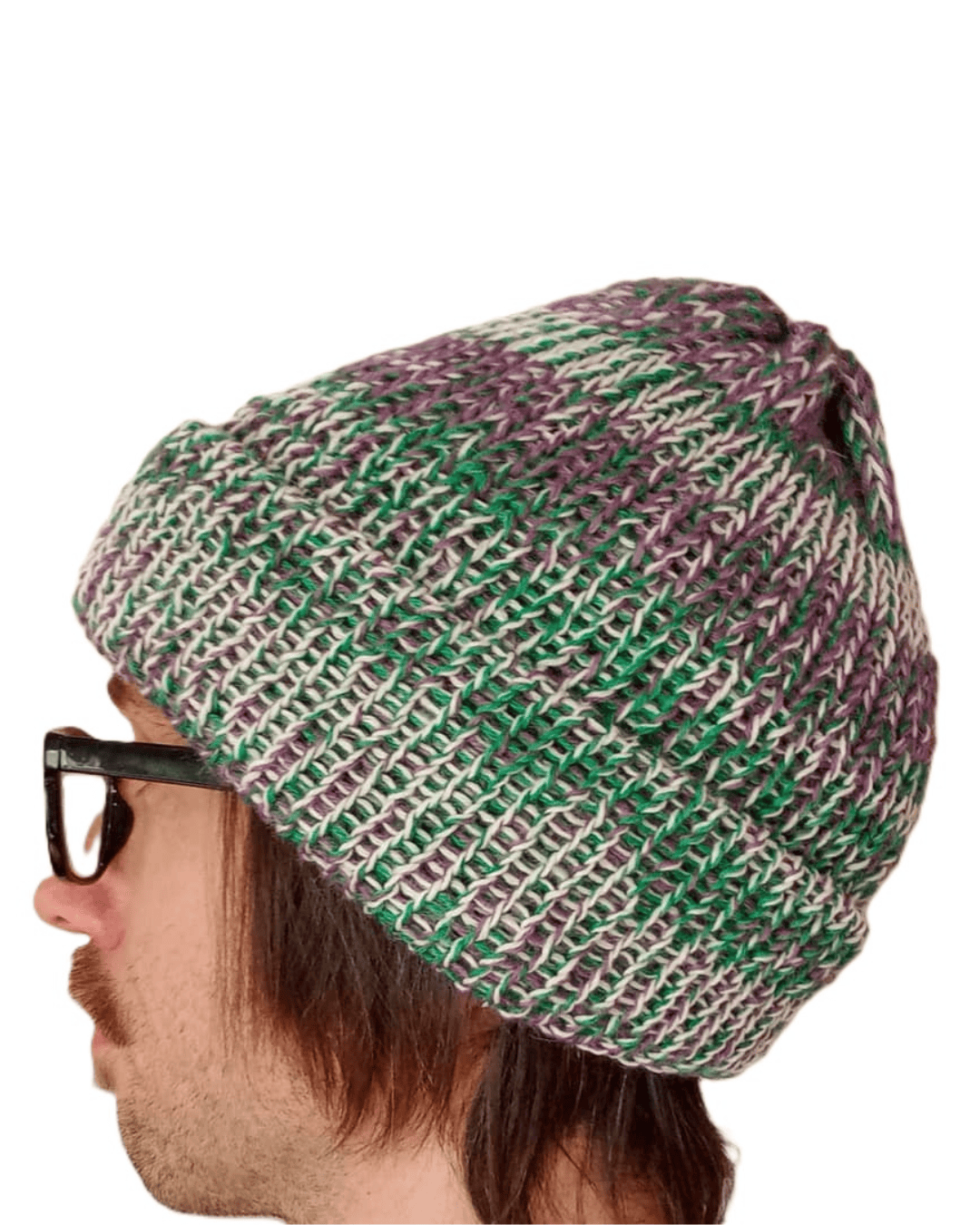 100% baby alpaca beanie in variegated green, white, and purple on a model