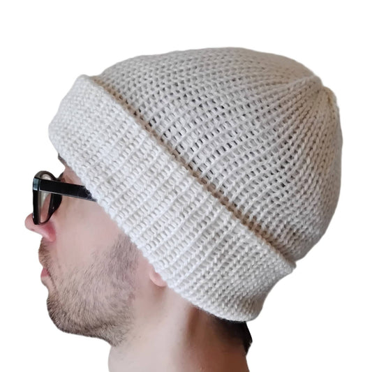 A white alpaca beanie on a model