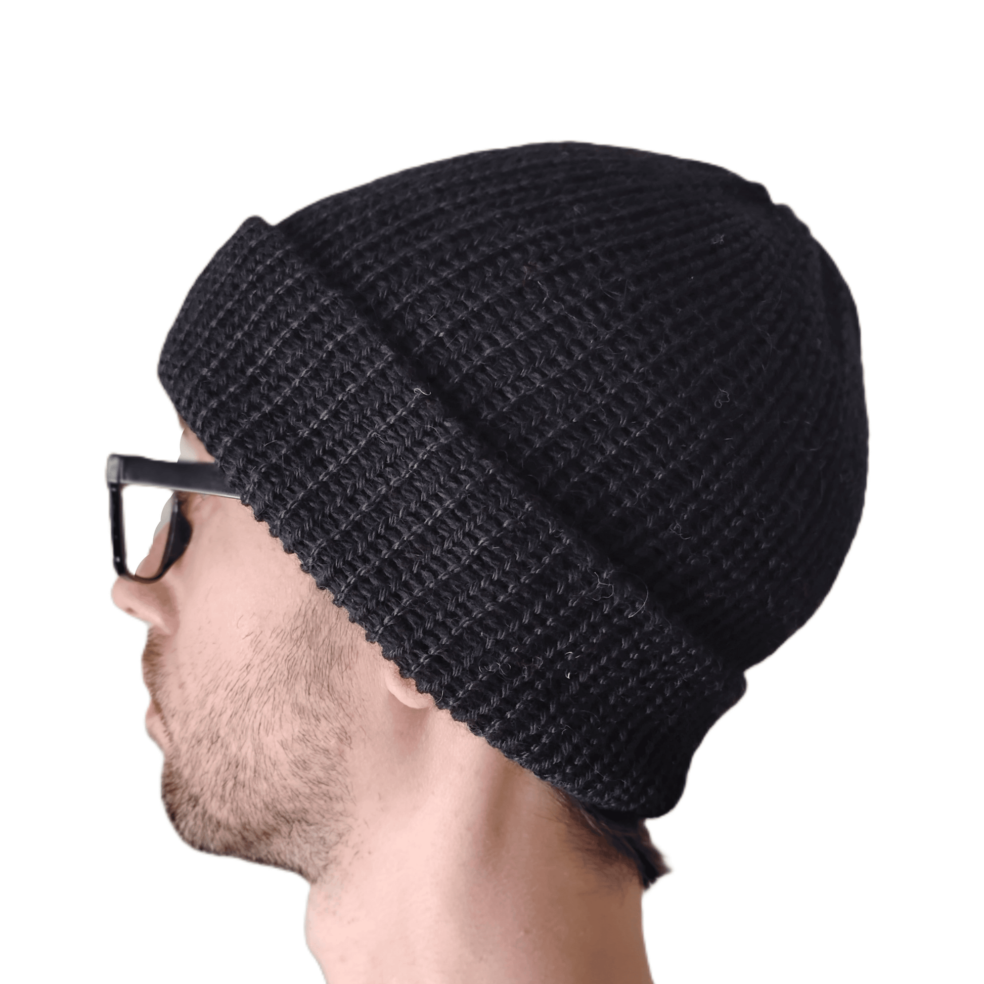 A black baby alpaca beanie on a model