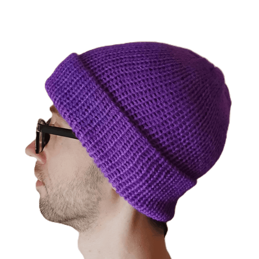 A purple baby alpaca beanie on a model