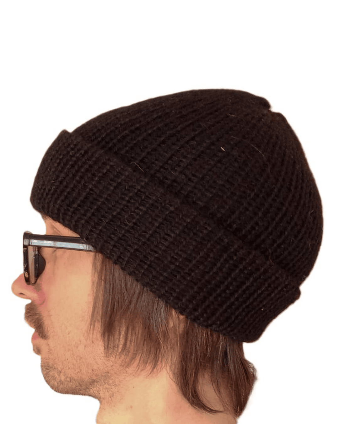 100% baby alpaca beanie in black on a model