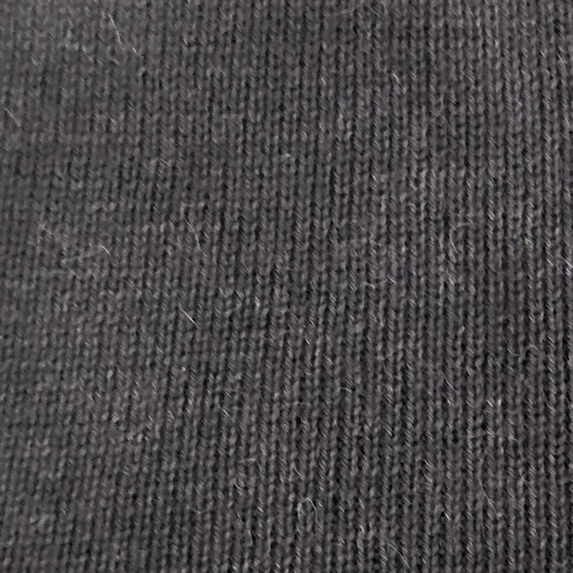 Close-up of dark charcoal knit alpaca.