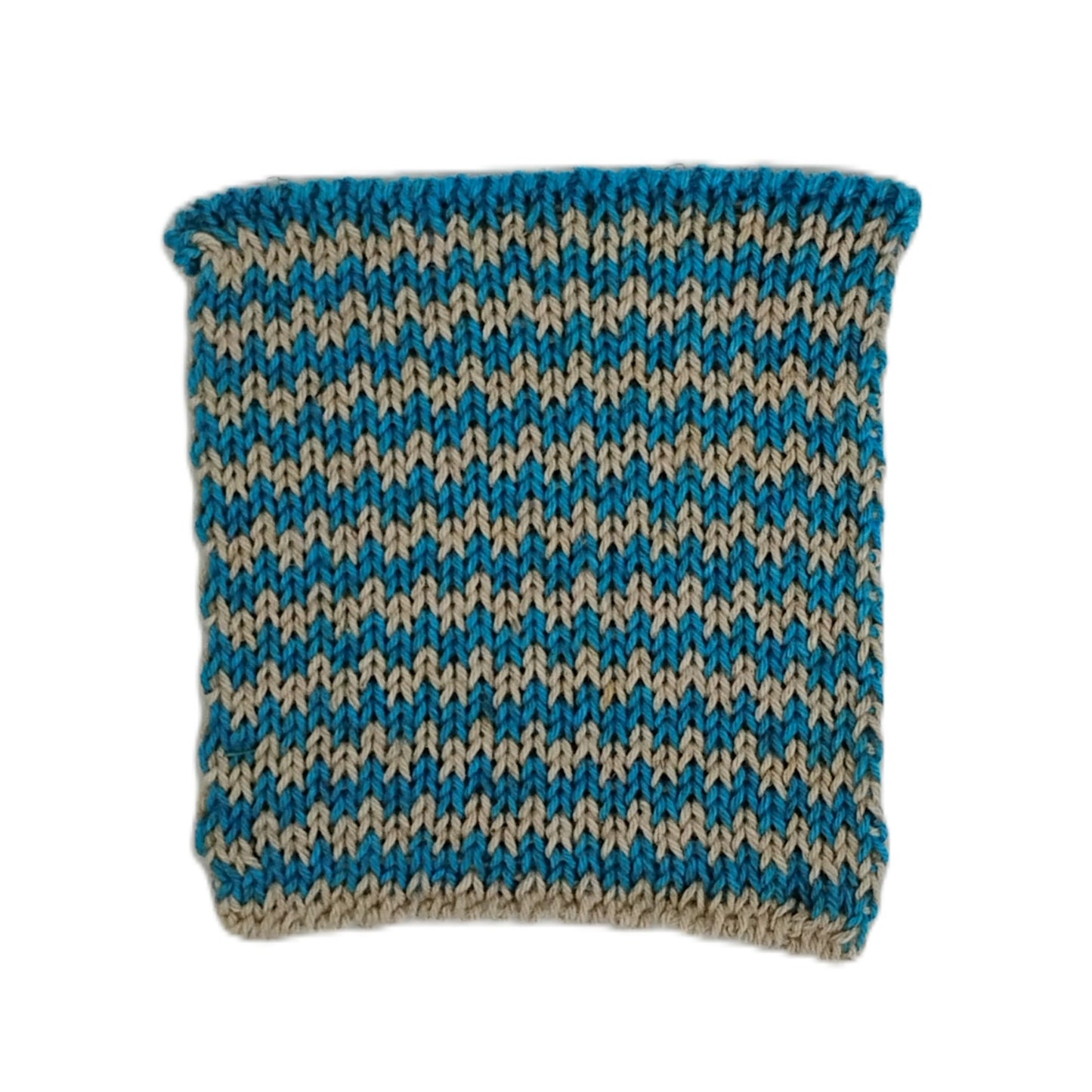 A knit swatch with a blue and beige chevron pattern, shown flat against a white background.
