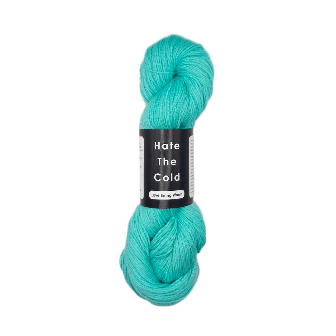 Turquoise skein of yarn with a label on a white background
