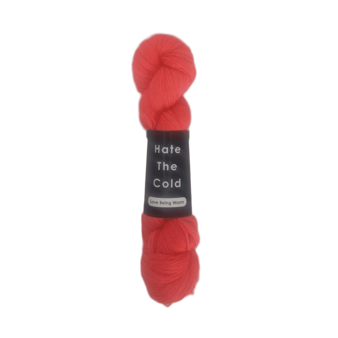 Red skein of yarn with a label on a white background