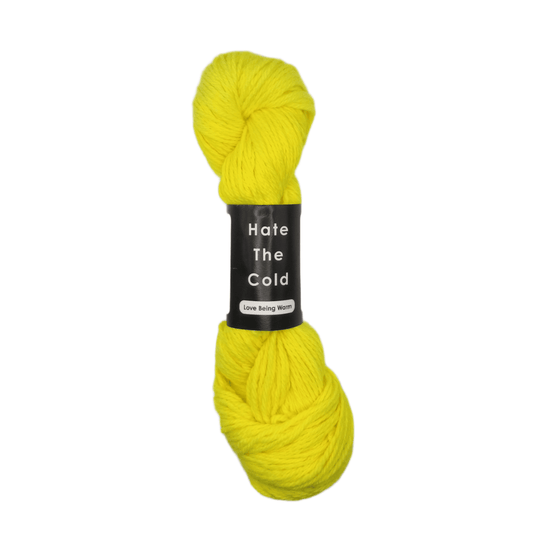 Yellow skein of yarn with a label on a white background