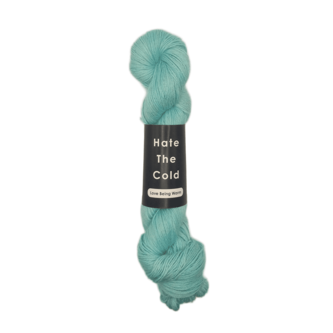 100% Peruvian baby alpaca yarn in fluorescent blue, fingering weight.