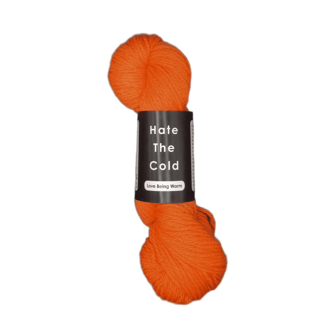 Orange skein of yarn with a label on a white background