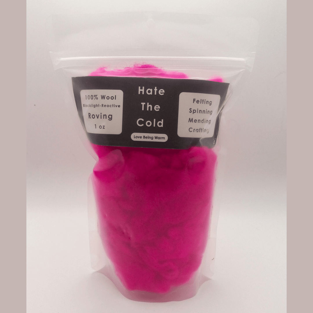 Pink wool roving in a clear package with a label on a white background