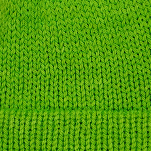 Close-up of a bright lime green knitted fabric texture.