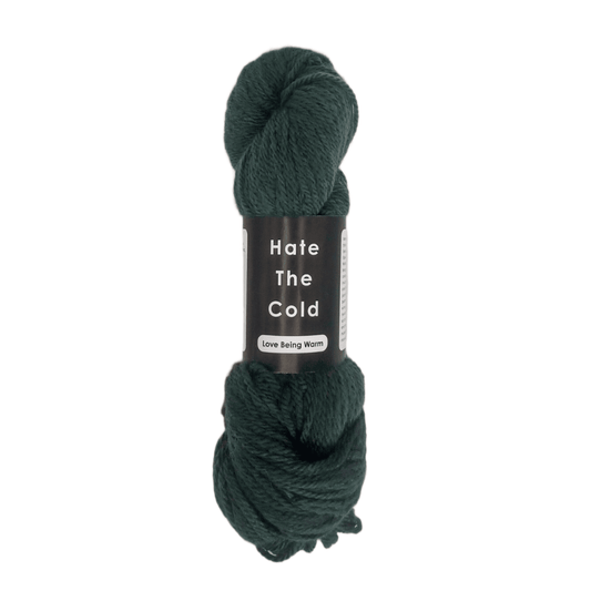 Forest green skein of 100% Australian merino wool yarn in aran weight.