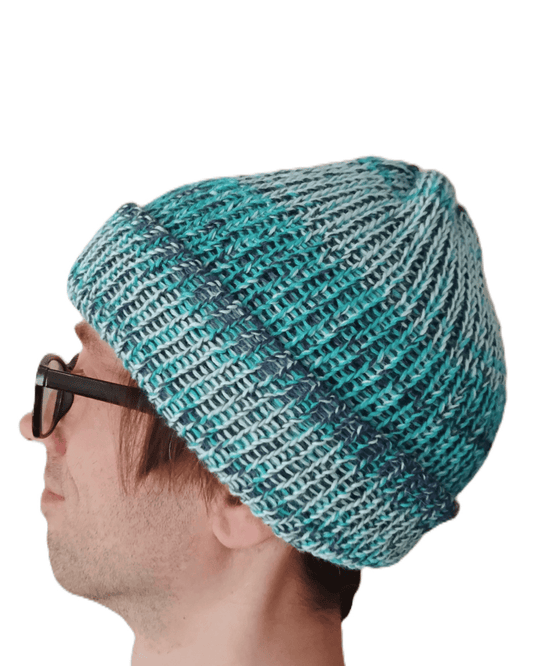 100% baby alpaca beanie in a mix of three different shades of blue