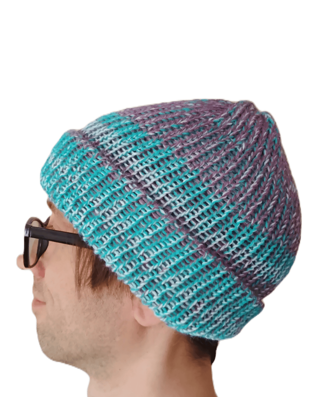 100% baby alpaca beanie in variegated blue, white, and purple on a model
