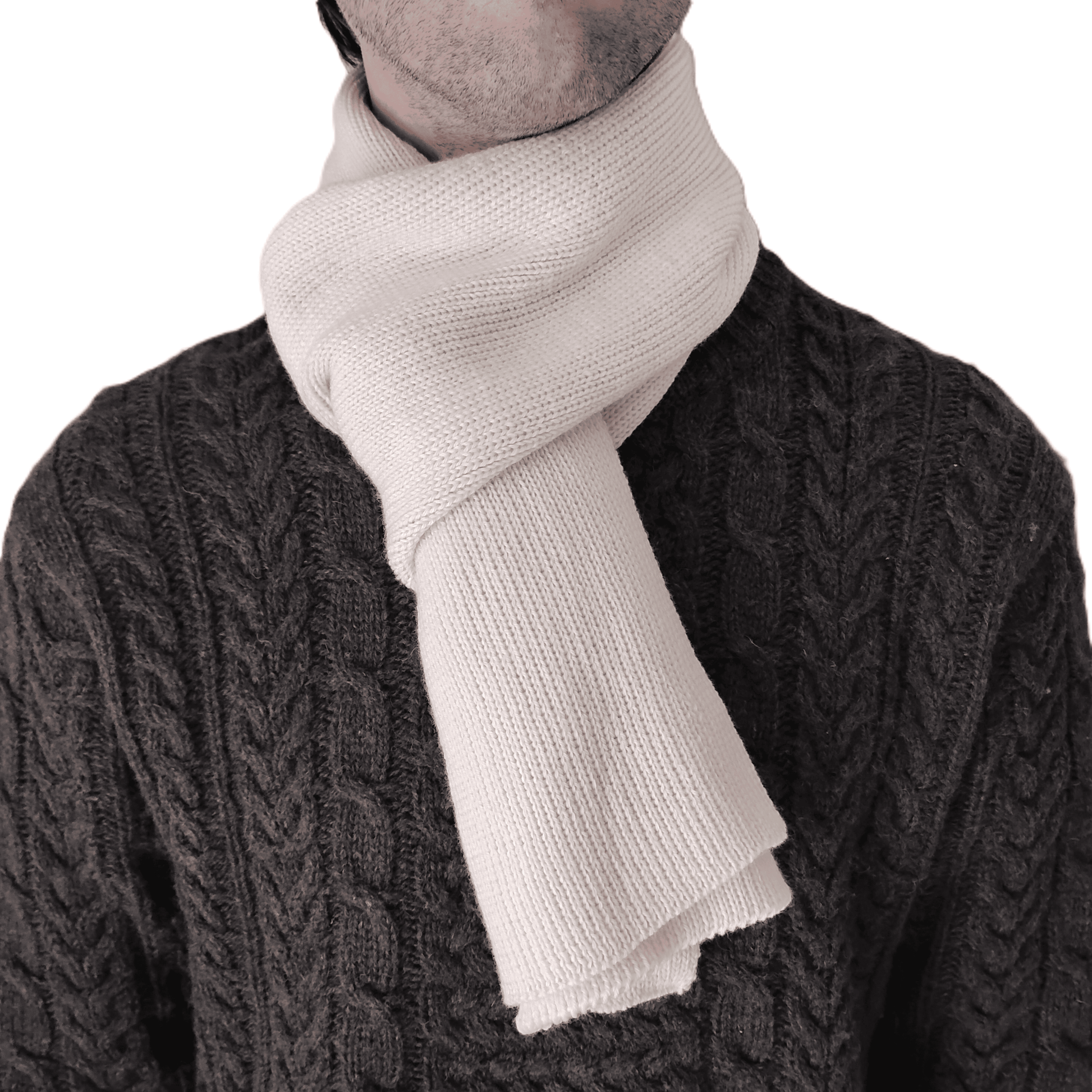 A close-up of a person wearing a thick, cream-colored knit merino wool scarf.