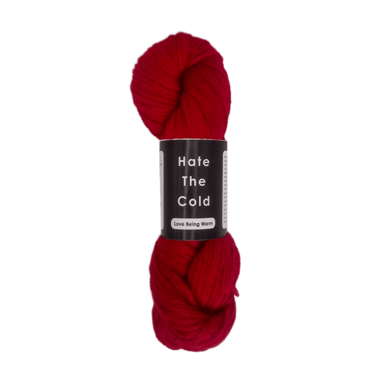 Red skein of 100% Australian merino wool yarn in aran weight.