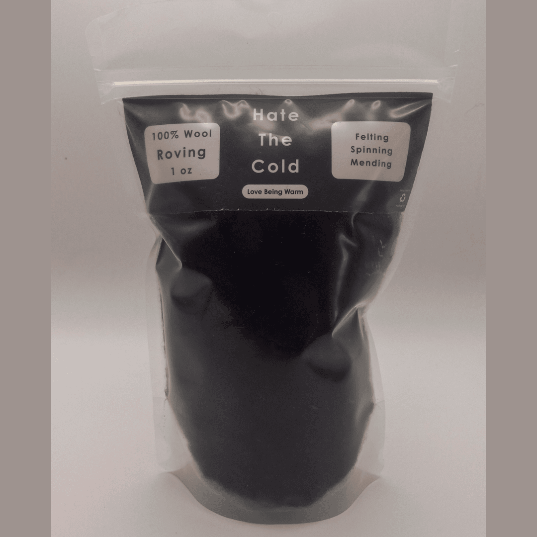 Black wool roving in a package with "Hate The Cold" on the label