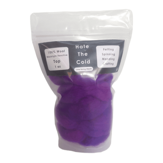 Wool top in fluorescent purple in a package with "Hate The Cold" on the label
