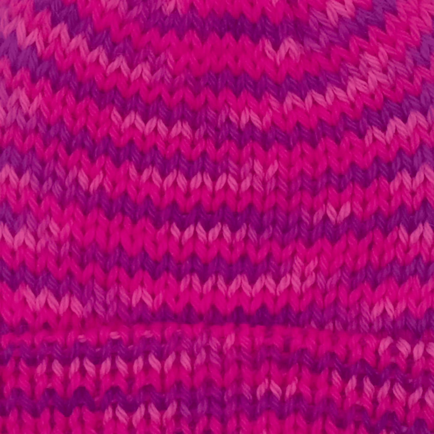 Close-up of worsted weight knit alpaca in pink multicolor