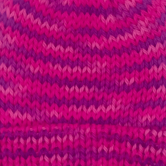 Close-up of worsted weight knit alpaca in pink multicolor