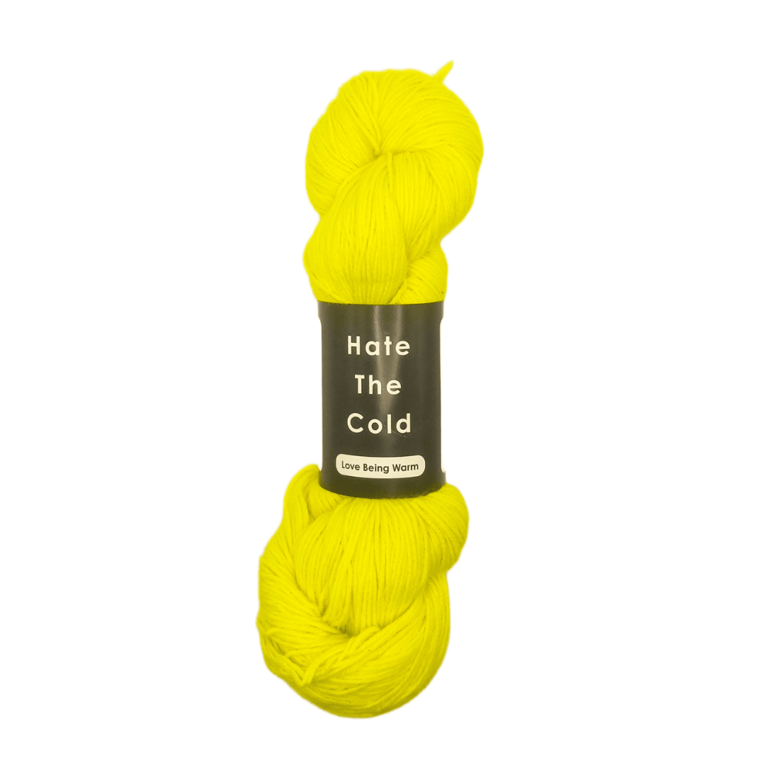 Yellow skein of yarn with a label on a white background